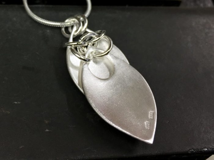 ujo_rocks_double_leaf_pendant_sterling_silver_frosted_hammered_back