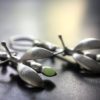 ujo_rocks_buzz_lightbutt_ville_valopylly_firefly_earrings_sterling_silver_glow_in_the_dark_frosted_daytime_front