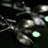 ujo_rocks_buzz_lightbutt_ville_valopylly_firefly_earrings_sterling_silver_glow_in_the_dark_frosted_oxidised_nighttime_front