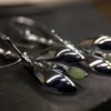 ujo_rocks_buzz_lightbutt_ville_valopylly_firefly_earrings_sterling_silver_glow_in_the_dark_polished_daytime_front