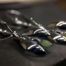 ujo_rocks_buzz_lightbutt_ville_valopylly_firefly_earrings_sterling_silver_glow_in_the_dark_polished_daytime_front