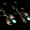 ujo_rocks_buzz_lightbutt_ville_valopylly_firefly_earrings_sterling_silver_glow_in_the_dark_polished_nighttime_front