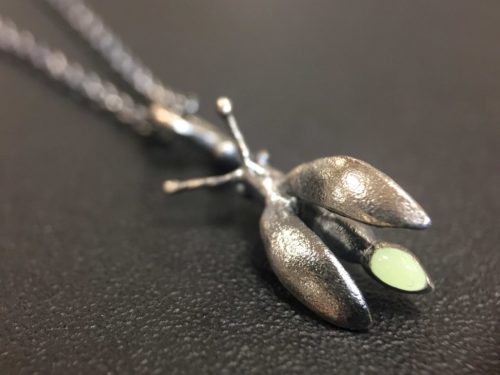 ujo_rocks_buzz_lightbutt_ville_valopylly_firefly_pendant_sterling_silver_glow_in_the_dark_frosted_oxidised_daytime_front