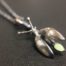 ujo_rocks_buzz_lightbutt_ville_valopylly_firefly_pendant_sterling_silver_glow_in_the_dark_frosted_oxidised_daytime_front