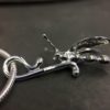 ujo_rocks_buzz_lightbutt_ville_valopylly_firefly_pendant_sterling_silver_glow_in_the_dark_polished_daytime_side