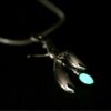 ujo_rocks_buzz_lightbutt_ville_valopylly_firefly_pendant_sterling_silver_glow_in_the_dark_polished_nighttime_front