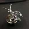 ujo_rocks_buzz_lightbutt_ville_valopylly_firefly_pin_sterling_silver_glow_in_the_dark_polished_daytime_top