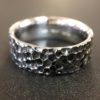 ujo_rocks_karu_wide_ring_sterling_silver_hammered_oxidised_front