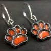 ujo_rocks_paw_earrings_sterling_silver_orange_glow_in_the_dark_frosted_oxidised_daytime_front