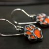 ujo_rocks_paw_earrings_sterling_silver_orange_glow_in_the_dark_frosted_oxidised_daytime_side