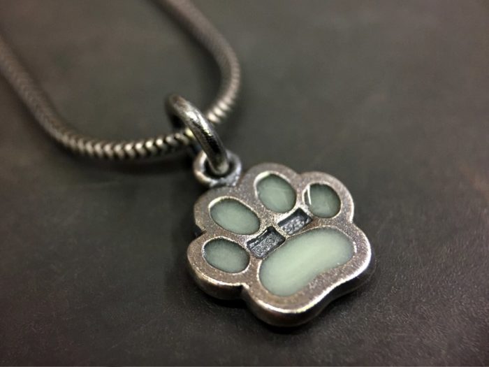 ujo_rocks_paw_pendant_sterling_silver_aqua_glow_in_the_dark_frosted_oxidised_daytime_back