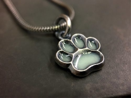 ujo_rocks_paw_pendant_sterling_silver_aqua_glow_in_the_dark_frosted_oxidised_daytime_front