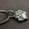 ujo_rocks_paw_pendant_sterling_silver_aqua_glow_in_the_dark_frosted_oxidised_daytime_side