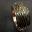 ujo_rocks_tree_bark_ring_bronze_green_glow_in_the_dark_polished_daytime_top