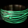 ujo_rocks_tree_bark_ring_bronze_green_glow_in_the_dark_polished_nighttime_front