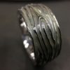 ujo_rocks_tree_bark_ring_sterling_silver_aqua_glow_in_the_dark_polished_daytime_top