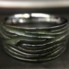 ujo_rocks_tree_bark_ring_sterling_silver_green_glow_in_the_dark_polished_daytime_front